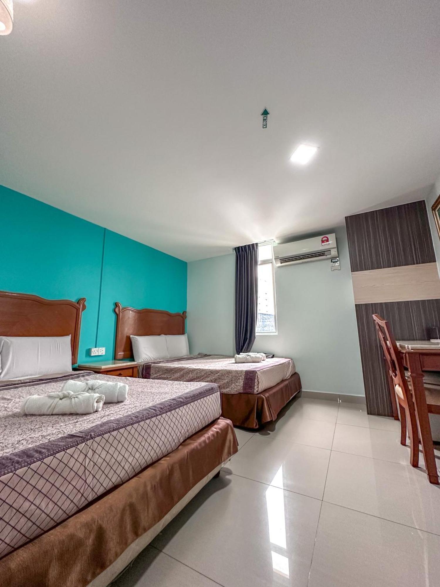 G Star Hotel Pantai Remis Extérieur photo