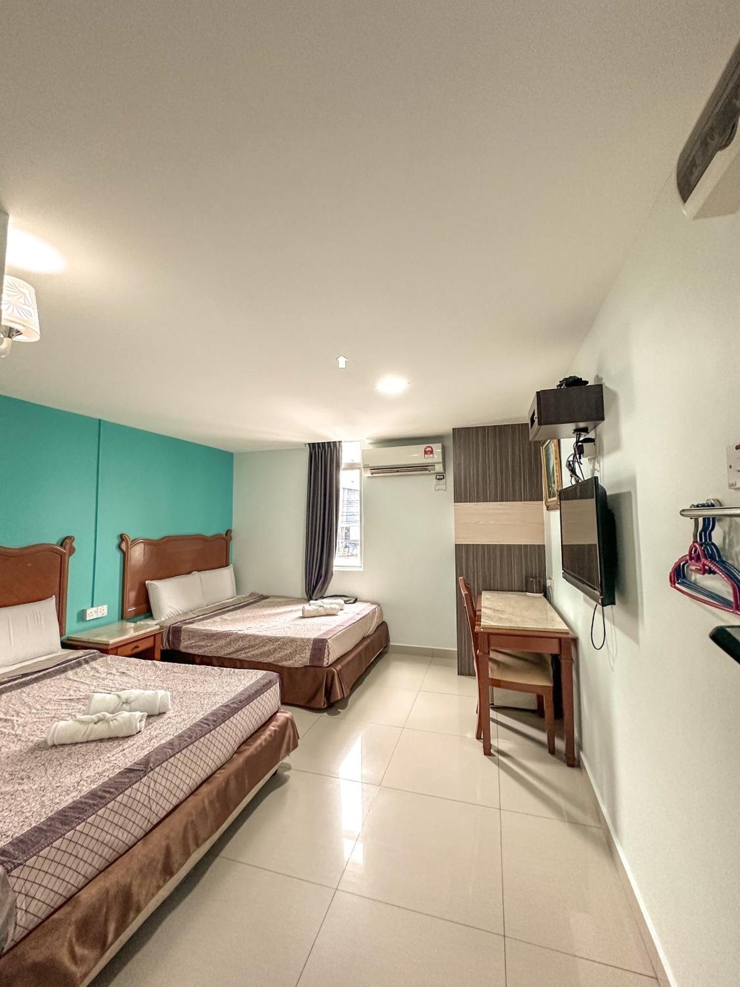 G Star Hotel Pantai Remis Extérieur photo